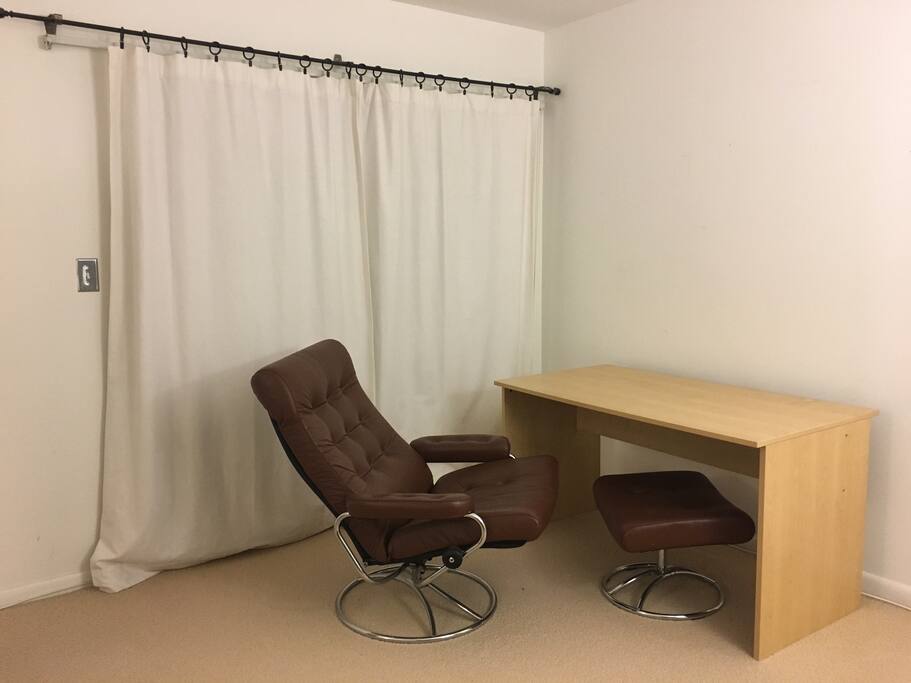 Personal desk with recliner chair and access to private balcony