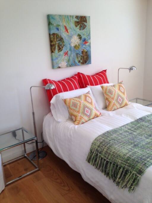 Full-sized bed, comfortable mattress and pillows.