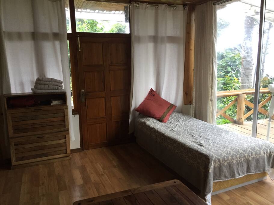Single bed next to the deck