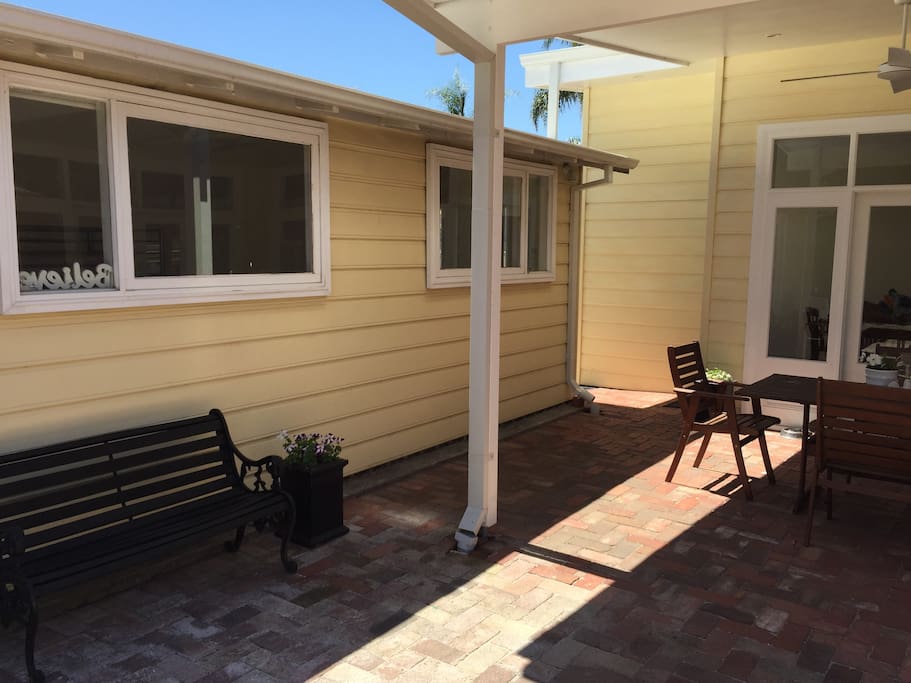 Side of studio guesthouse overlooking alfresco and main house
