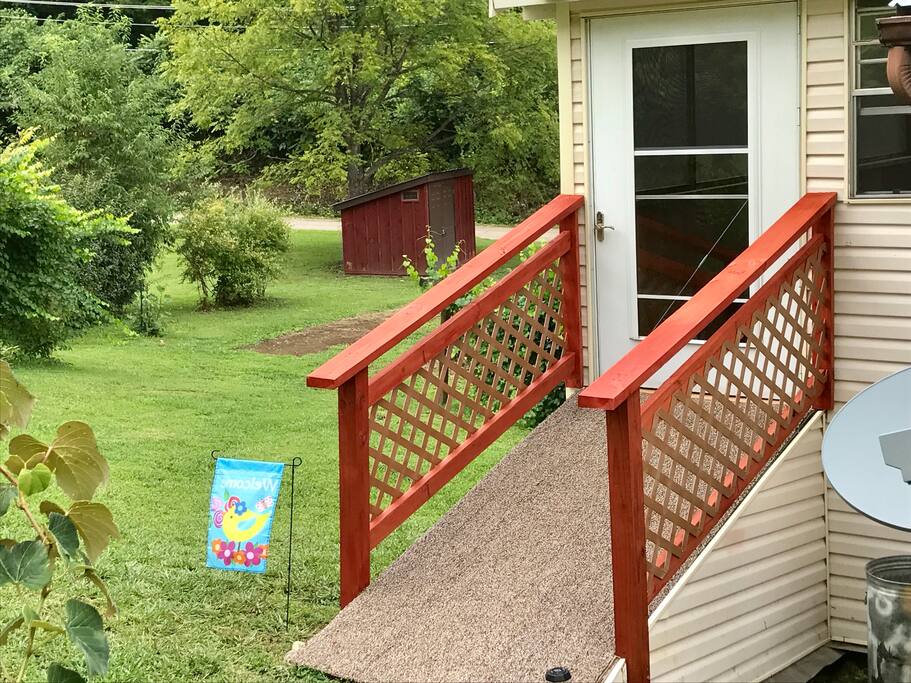 Entrance ramp to The Birdhouse enclosed porch and apartment entry.