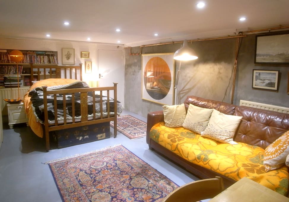 Old fashioned wooden bedstead, DVD library, Netflix, Tivo