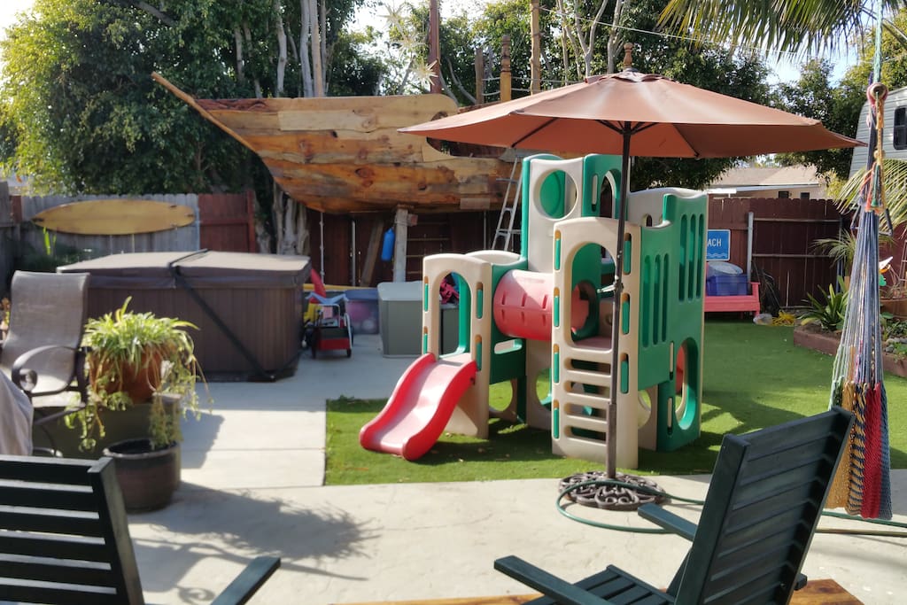 Play area in a protected fenced back yard for the kiddos and your very own Pirate Ship!