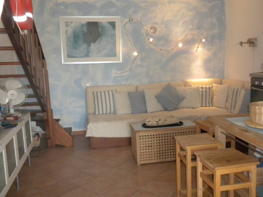 Living room with couch that opens into a 3 people bed