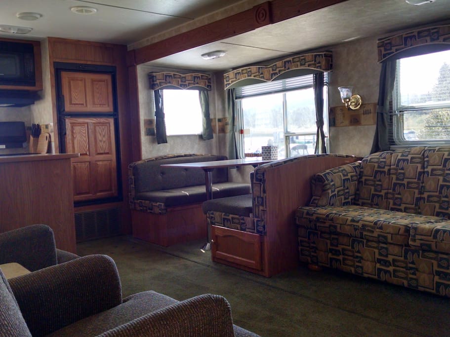 Dining room and love seat both fold down into beds