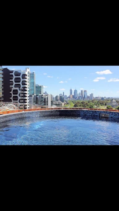 Rooftop pool with view of the city & The Shrine of Remembrance