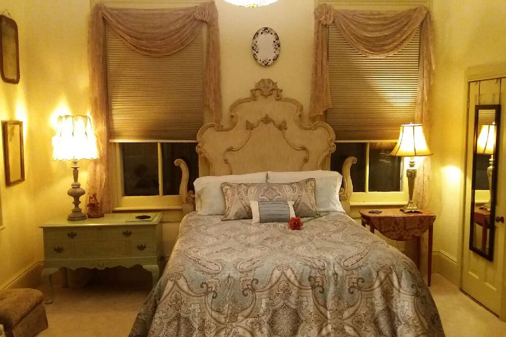 Beautiful French Victorian-inspired headboard frame and furnishings welcome you to the Annabelle Suite.