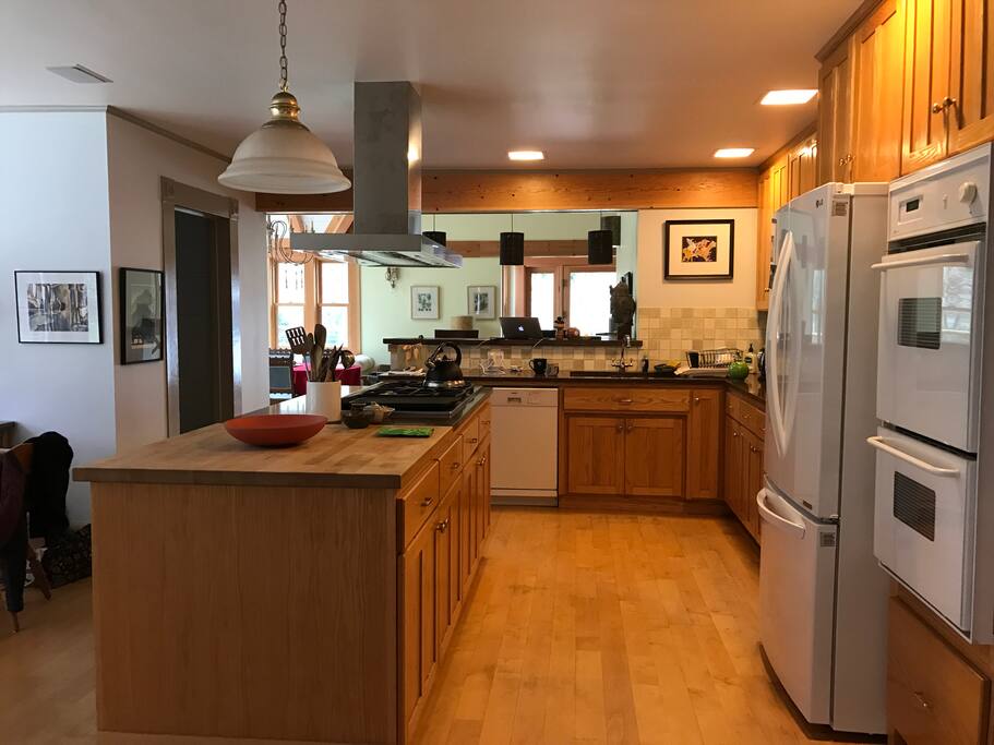 Large kitchen next to great room, dining room, family room