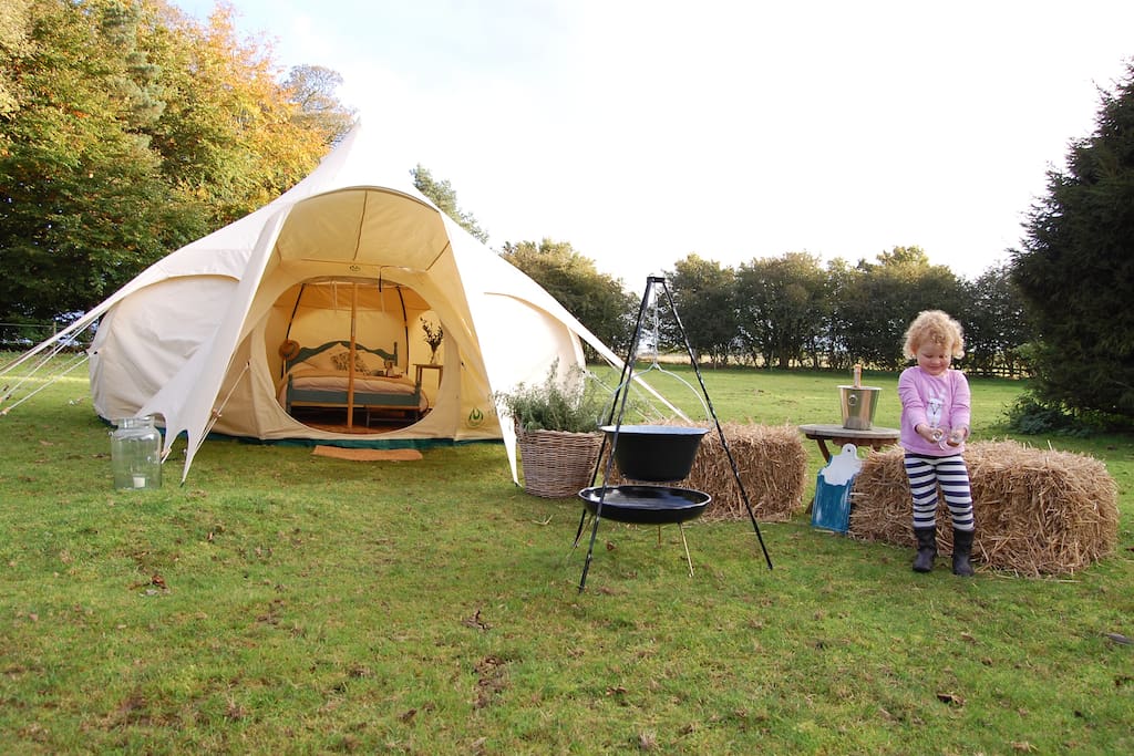 What more do you need, stunning tent, your own field, and a bottle of fizz!