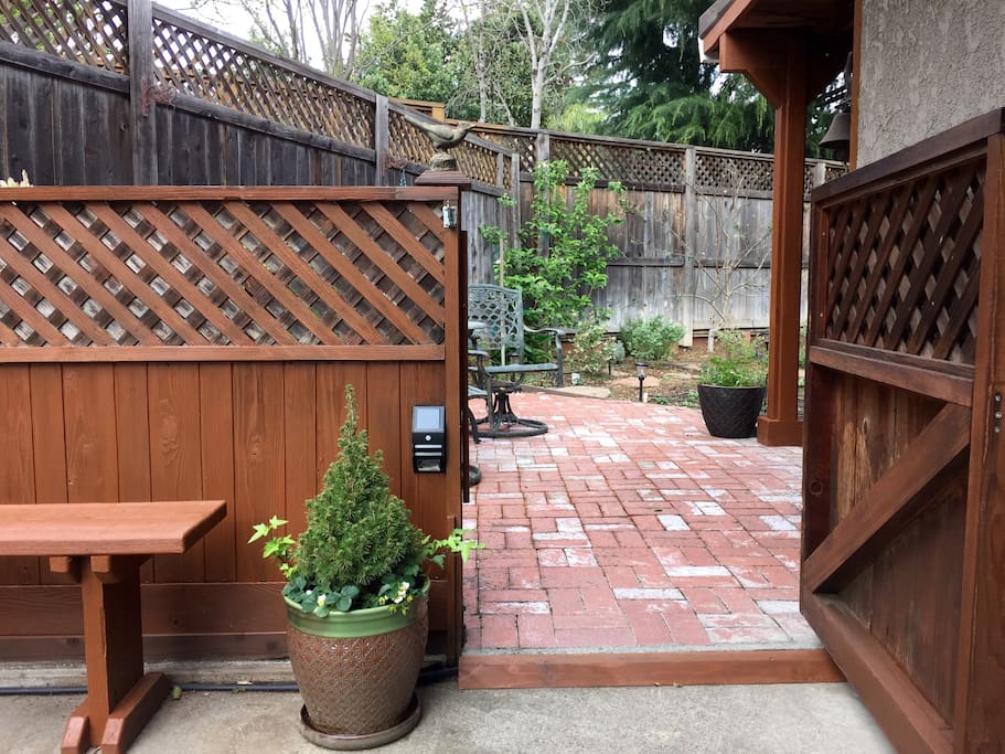 Through this gate you will find the private patio and slider to the living room.