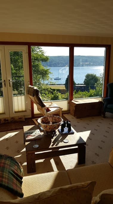 Sit back and relax in the sitting room looking over the loch.