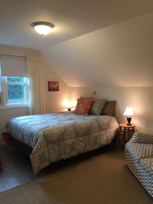 Queen size bed. Touch to turn on lamps on each side of bed.