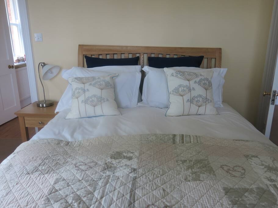 King size bed with Egyptian cotton bedding