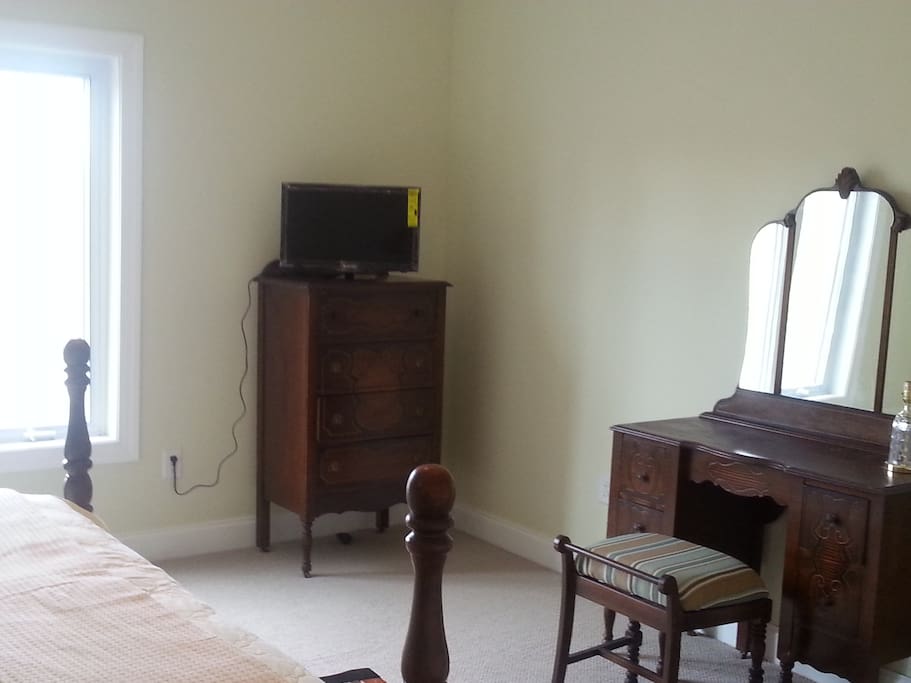 That is a brand new TV on top of the chest of drawers.
