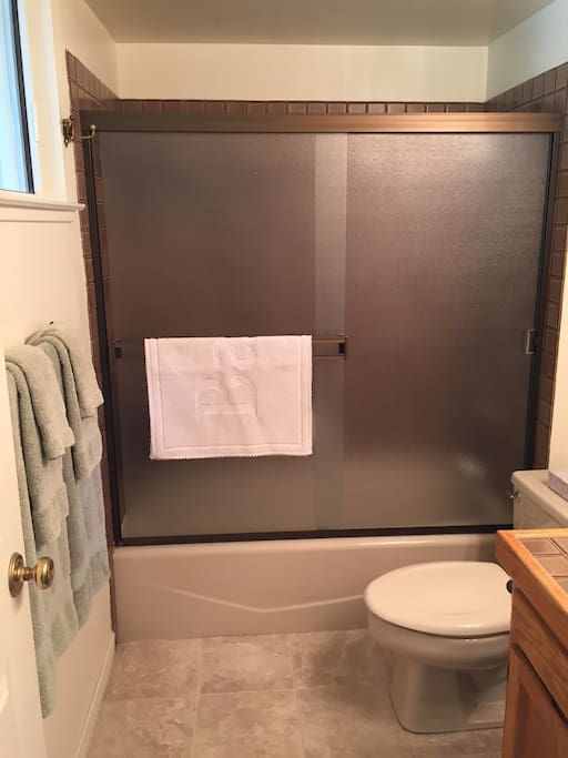 Full bathroom with shower/tub combo attached to Bedroom 1 (King bedroom)