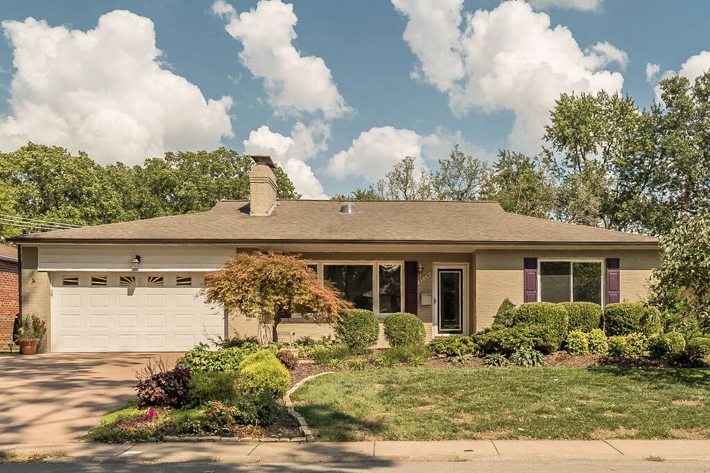 Look for purple shutters and purple front door, Japanese Maple in front.