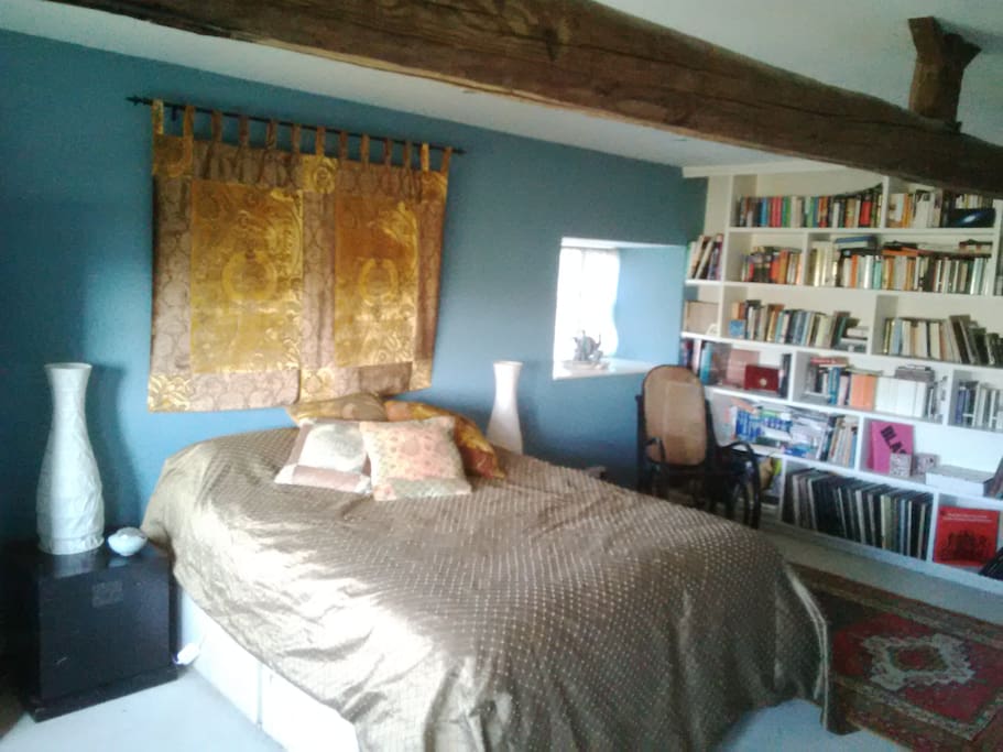 The main bedroom with plenty of reading matter...