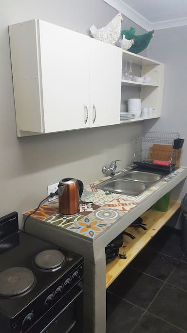The kitchen offers everything you need including a stove, microwave oven and fridge.