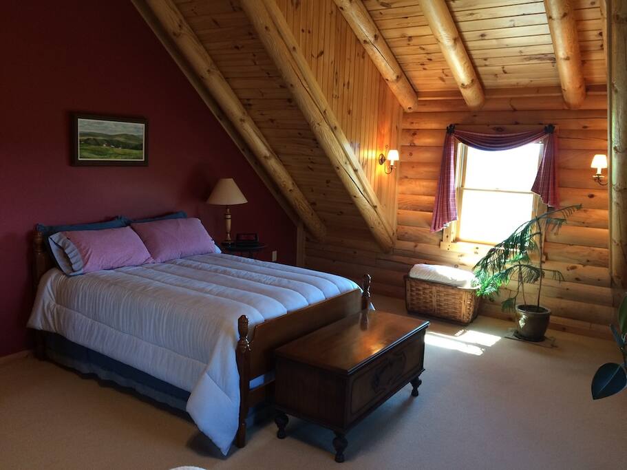 Full size bed with garden and mountain views