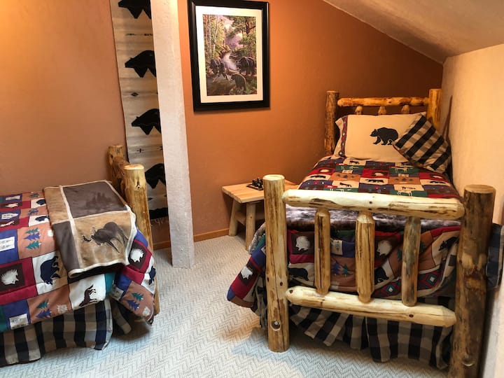 Loft bedroom with two twin beds (and bonus twin bed in alcove). 