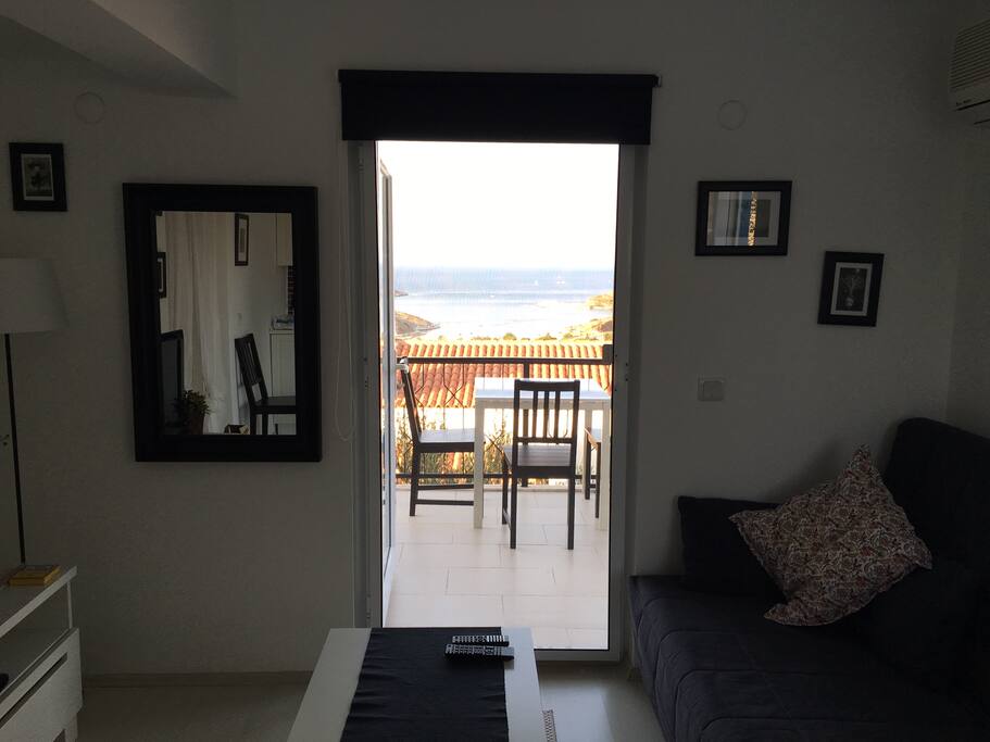 Sitting room towards balcony, with sofa bed on the right