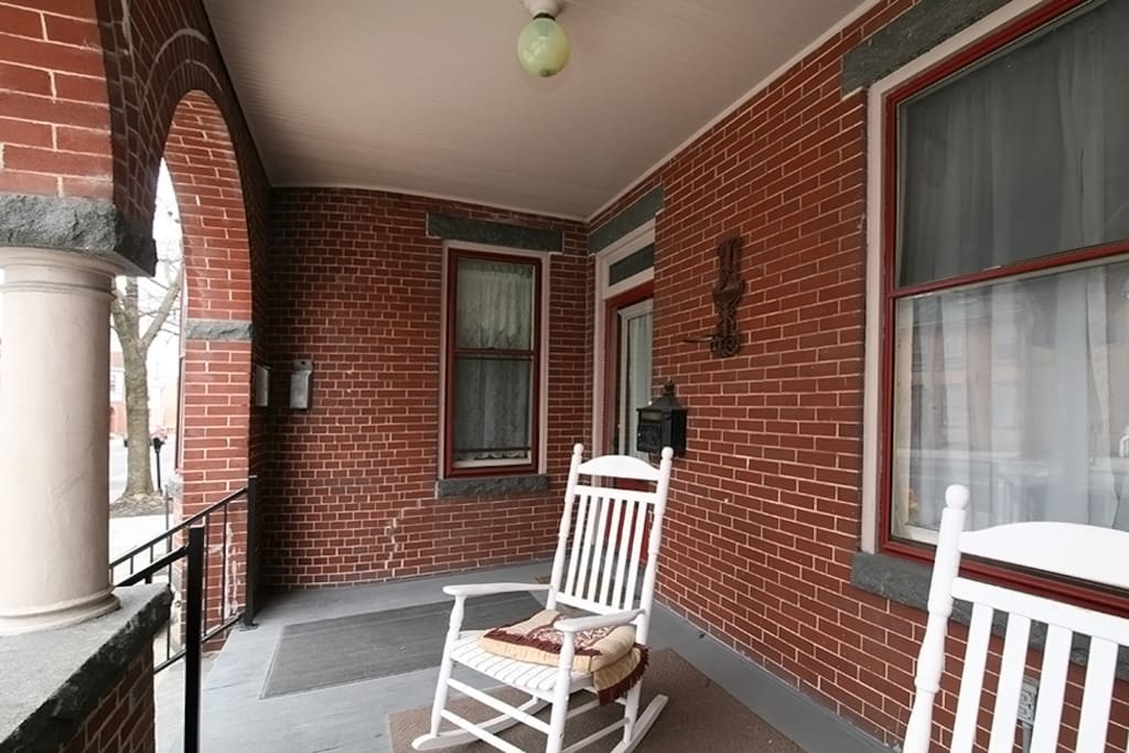 Beautiful deep front porch perfect for people watching or parade viewing.
