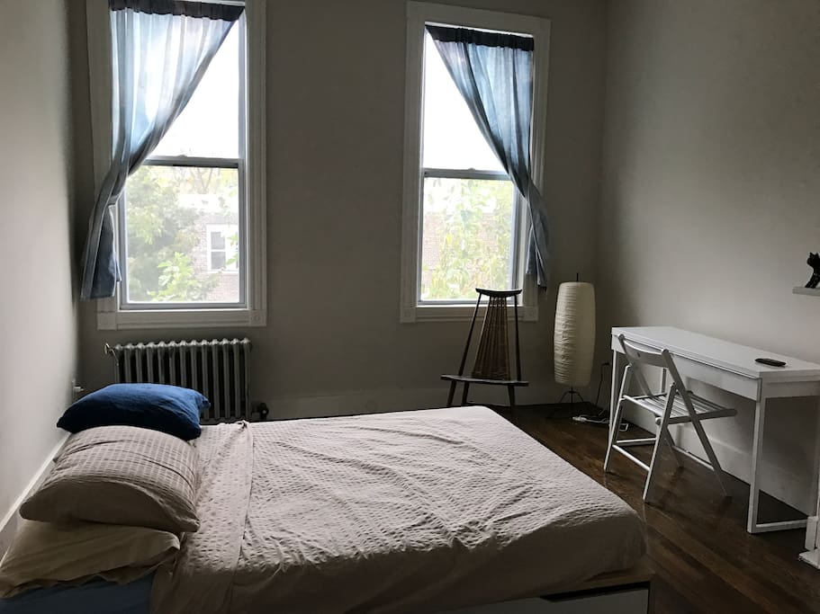 Bedroom is on second floor, faces toward the backyard