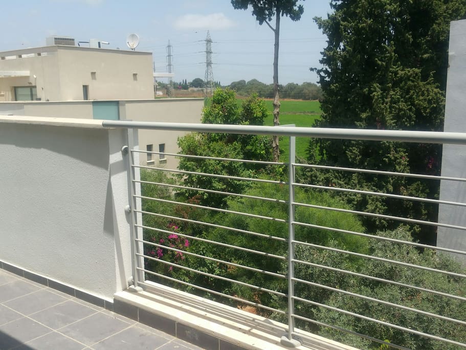 view from a balcony on the third floor to the fields. Mult light