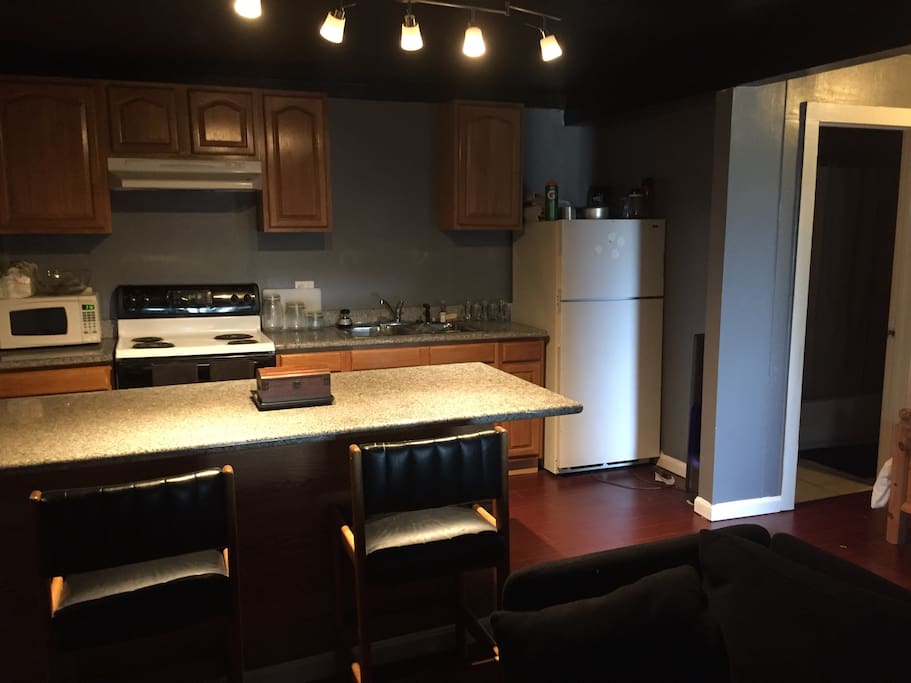 Full kitchen with plenty of space to cook a full course meal with space from large marble top island. Refrigerator, full stove (with pots) and microwave access.