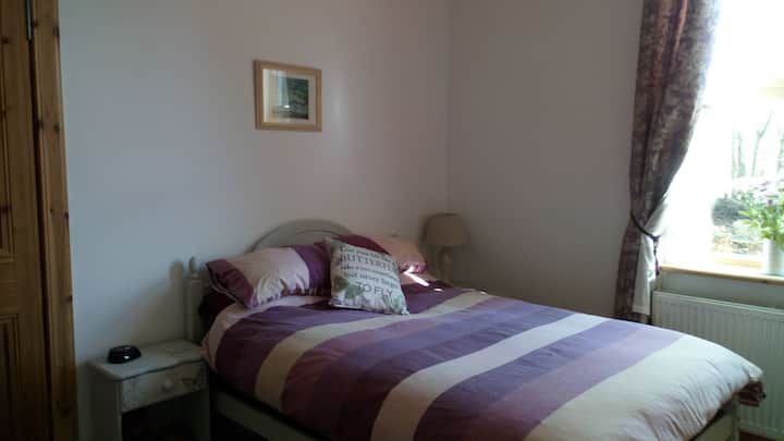 comfortable double bed with plenty of pillows and clean sheets. 