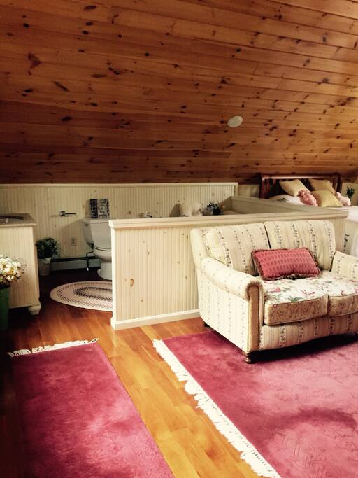 Upstairs large bedroom, looking at sitting area to open concept queen bedroom.