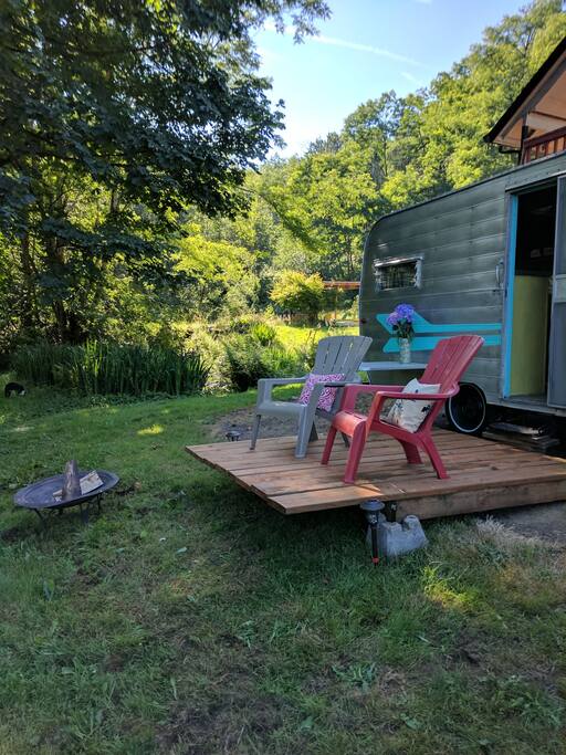 Enjoy the serenity of glamping in the woods in a vintage capmper!