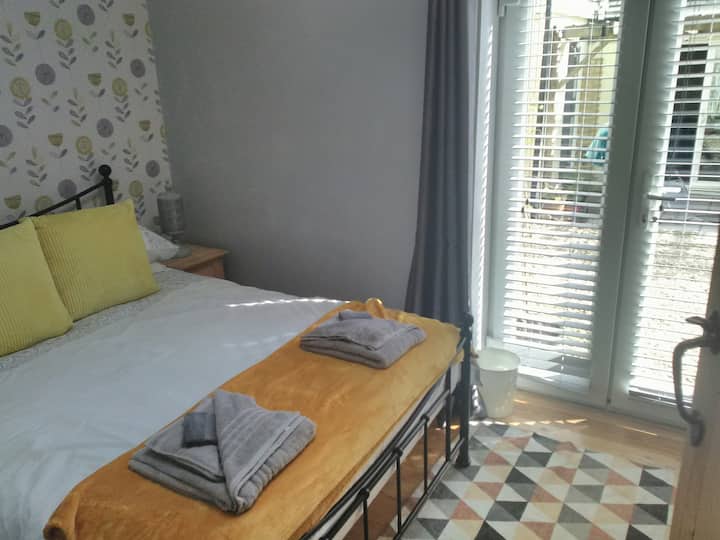 Second double  bedroom leading onto courtyard