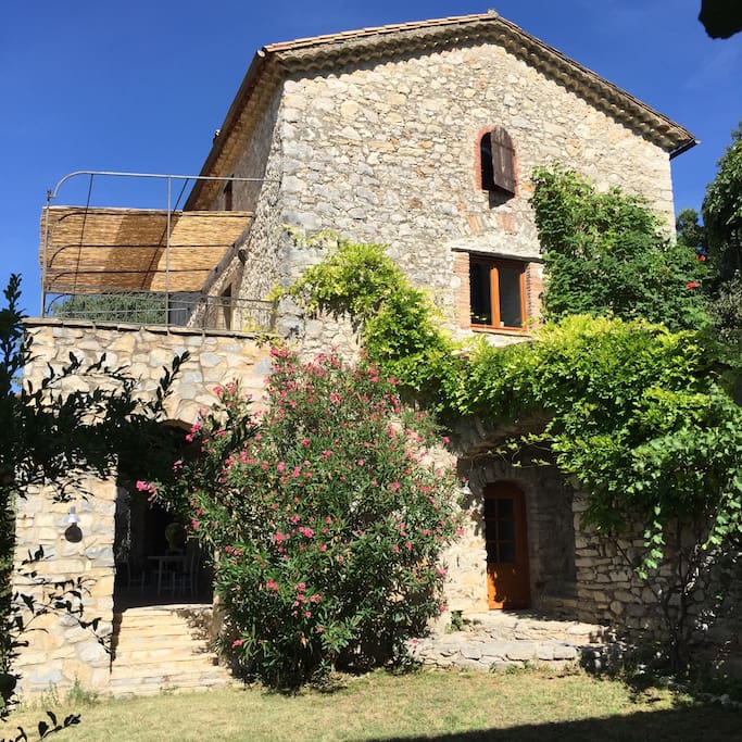 View from the private garden where there is a separate terrace under a big fig tree.