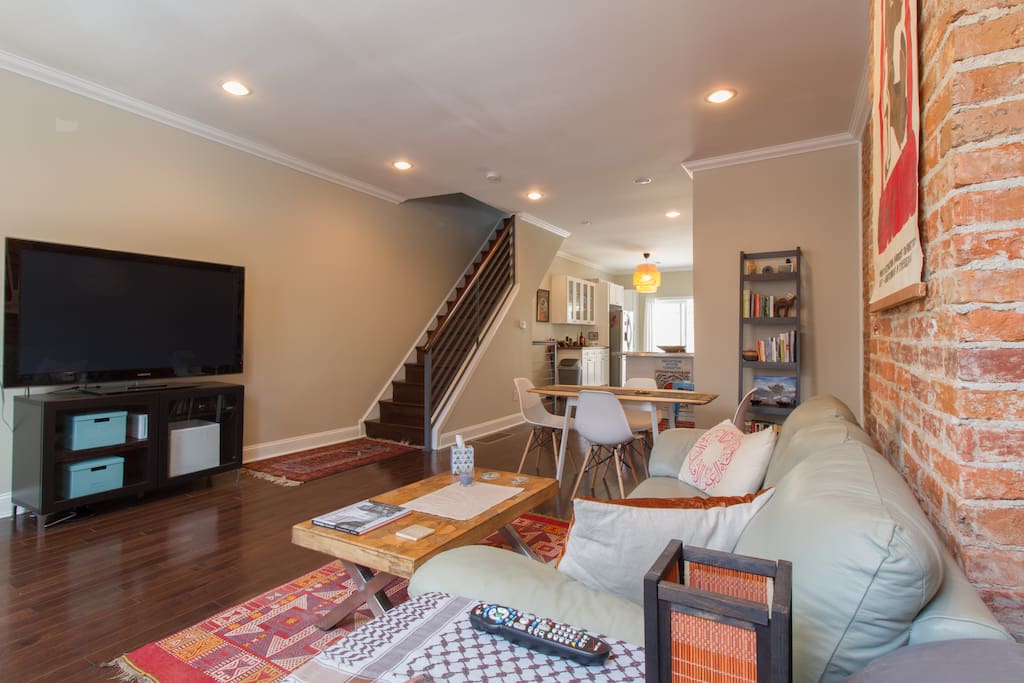 First floor features living and dining areas, half bath, large kitchen, and exit to large patio