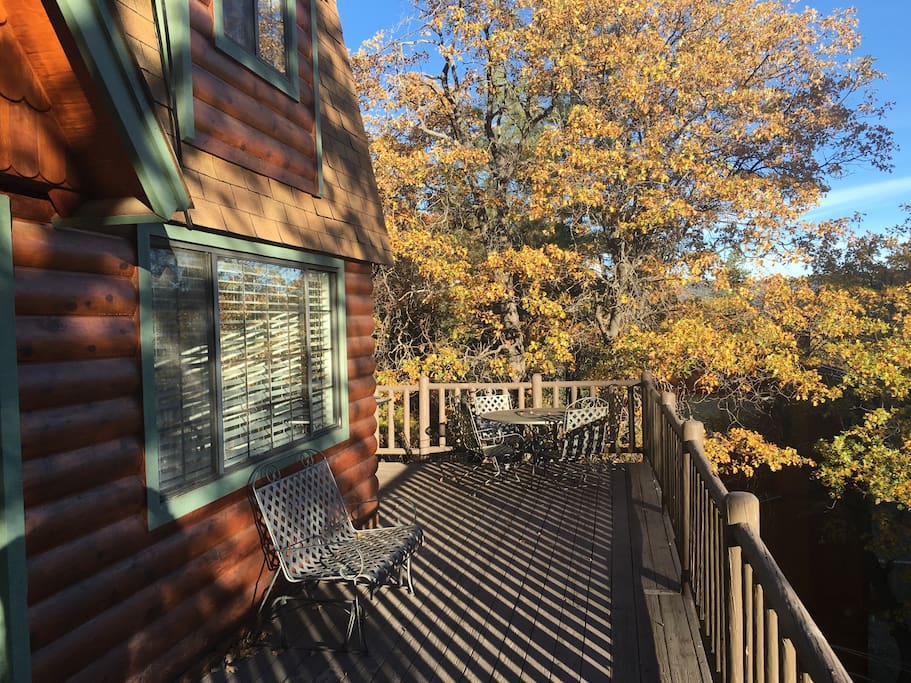 Deck View in Autumn where our cabin is nestled among oak trees that change color