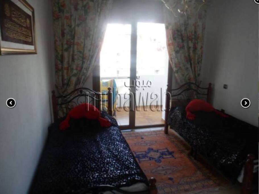 chambre avec balcon et vue sur l'océan.