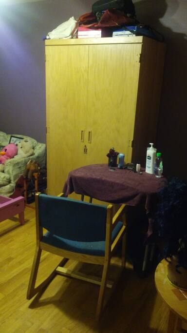 There is a wardrobe and closet, a computer desk and dresser.