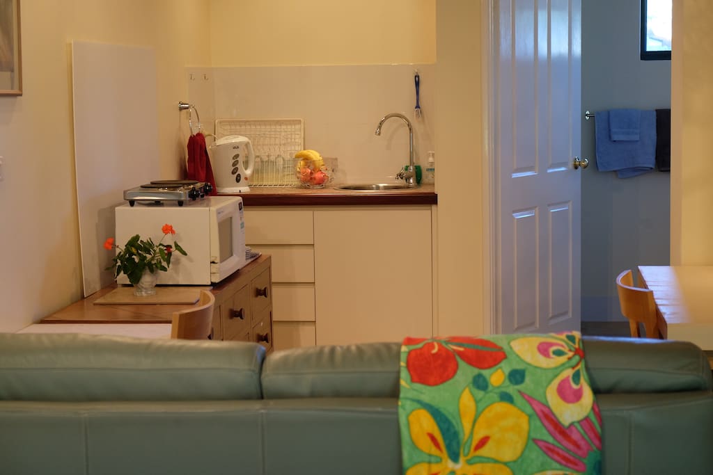 Leather lounge, kitchen thru to bathroom