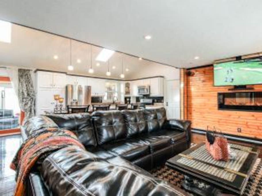 Living room with flat screen tv and surround sound.