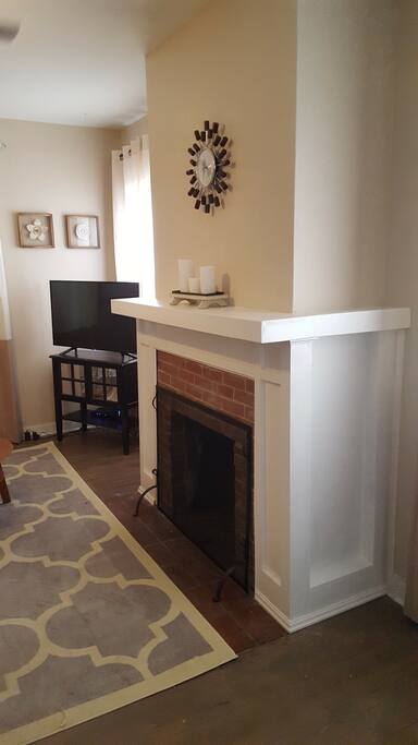 Fireplace and television.