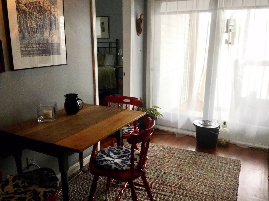 Shared eat in kitchen with a balcony.