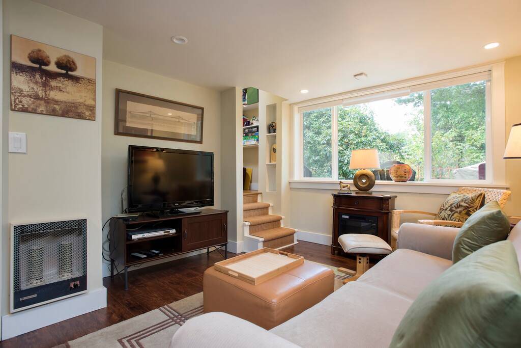 Another view of the living room. On the wall to the left of the TV is the wall heater, the switch to operate it is on the heater itself.