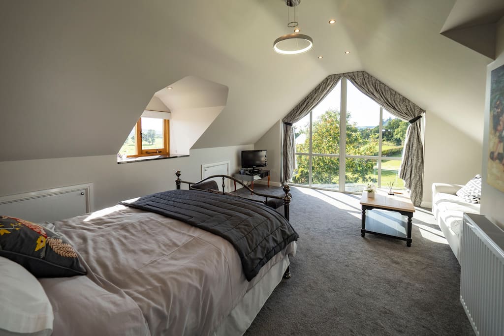 Grey room. Spacious enough for two extra single beds