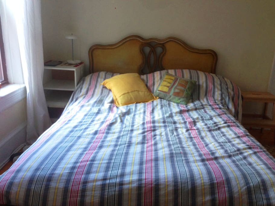 Bedroom, has a full-sized bed, a closet, and desk for you to use.