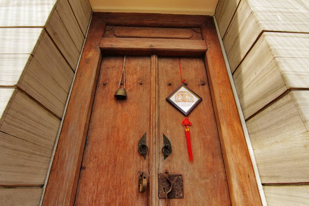 Welcome to Raben House. Enter the house through the antique door from Demak ( area in central Java)