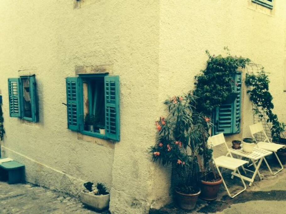 Old stone house with walls 65 cm thick, situated in a typical Mediterranean traffic-free street.