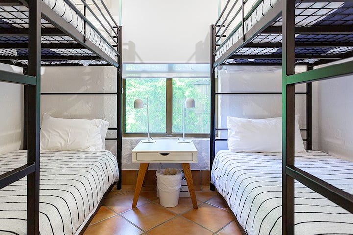 Bunk room with custom made bunks so you can sit up on the bottom bunk!
