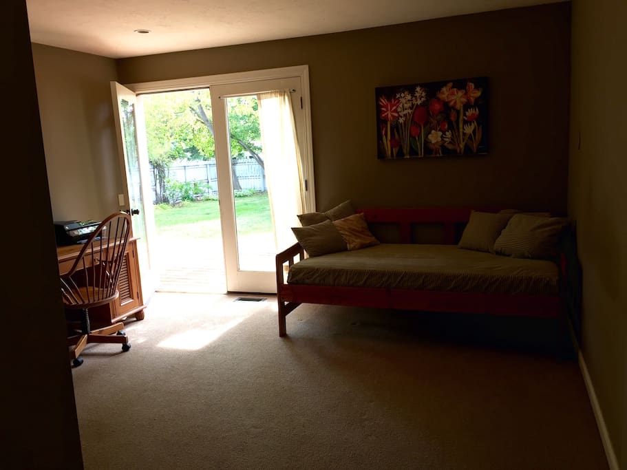 Private entrance and deck off of master suite with day bed and desk. Queen bed in separate area