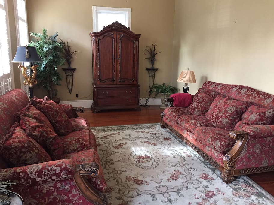 Front living room with TV located in armoire.